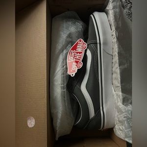 Gray Old School Vans.